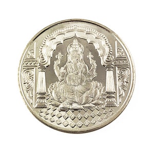 Fine Silver Ganesh coin depicting Ganesh , the elephant god in the center, Ganesh Pure silver coin in 10 gm for diwali, puja wedding return gift. The coin features intricate detailing and Sanskrit text.  It's a round, silver-Silver collectible item, ideal for religious or cultural purposes. The design showcases the god in a seated position on a lotus flower,
Ganesh Pure silver coin fine silver 999 A silver coin with a raised image of the Hindu deity Ganesha sitting on a lotus flower.