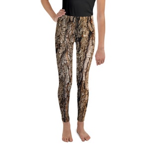 May include: Brown and tan leggings with a tree bark pattern.