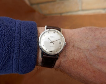 Orologio da uomo Edele anni '50 con quadrante argentato e finestra della data, movimento automatico svizzero da 25 gioielli, cassa in acciaio inossidabile