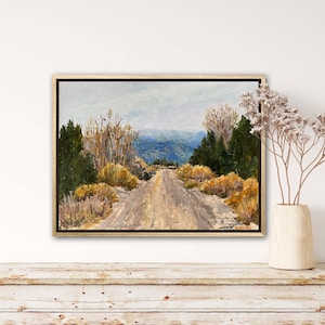 May include: A painting of a dirt road leading through a forest with a mountain range in the background. The road is lined with trees and bushes, and the sky is a light blue color.