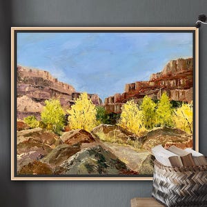 May include: A painting of a canyon landscape with a blue sky and yellow trees in the foreground. The canyon walls are red and brown.