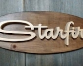 1963 Oldsmobile Starfire Emblem Oval Wall Plaque-Unique scroll saw automotive art created from wood for your garage, shop or man cave.