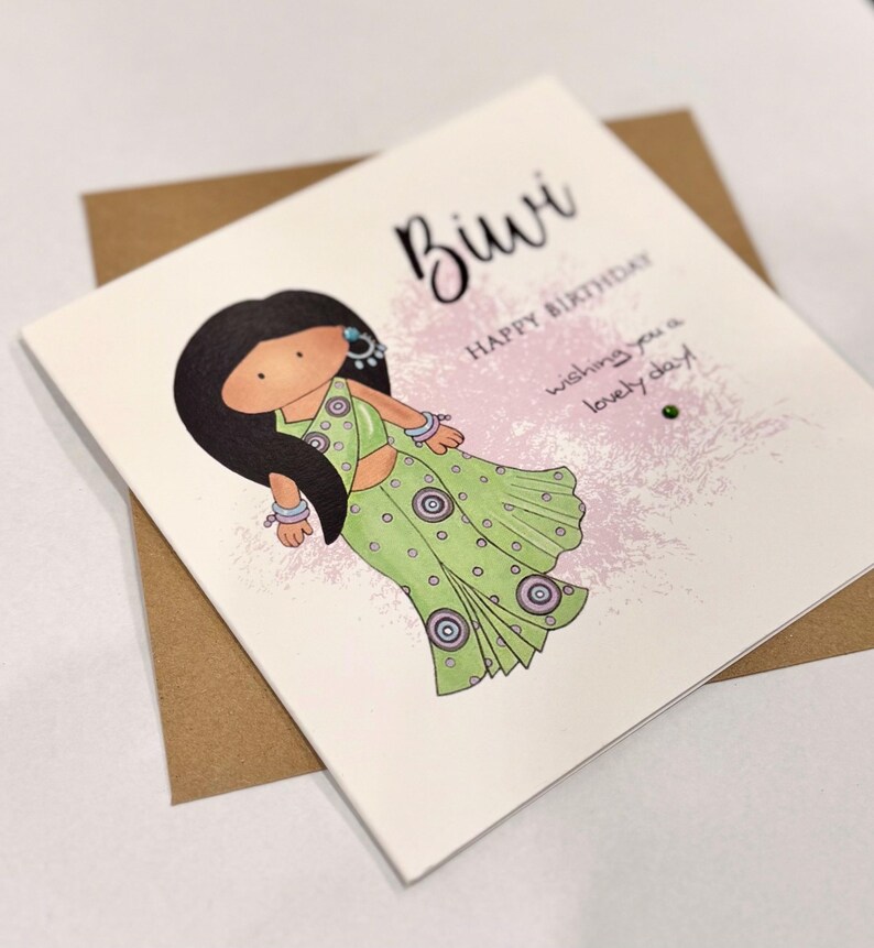 A cute birthday card for a special Biwi (wife) This South Asian lady is dressed to impress in a pastel green sari with matching jewellery. A perfect keepsake card to make her smile. Card front reads, Biwi happy birthday, wishing you a lovely day.