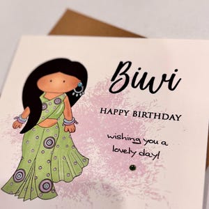 A cute birthday card for a special Biwi (wife) This South Asian lady is dressed to impress in a pastel green sari with matching jewellery. A perfect keepsake card to make her smile. Card front reads, Biwi happy birthday, wishing you a lovely day.