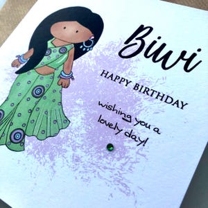 A cute birthday card for a special Biwi (wife) This South Asian lady is dressed to impress in a pastel green sari with matching jewellery. A perfect keepsake card to make her smile. Card front reads, Biwi happy birthday, wishing you a lovely day.