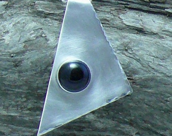 May include: A silver triangle pendant necklace with a black gemstone in the center.