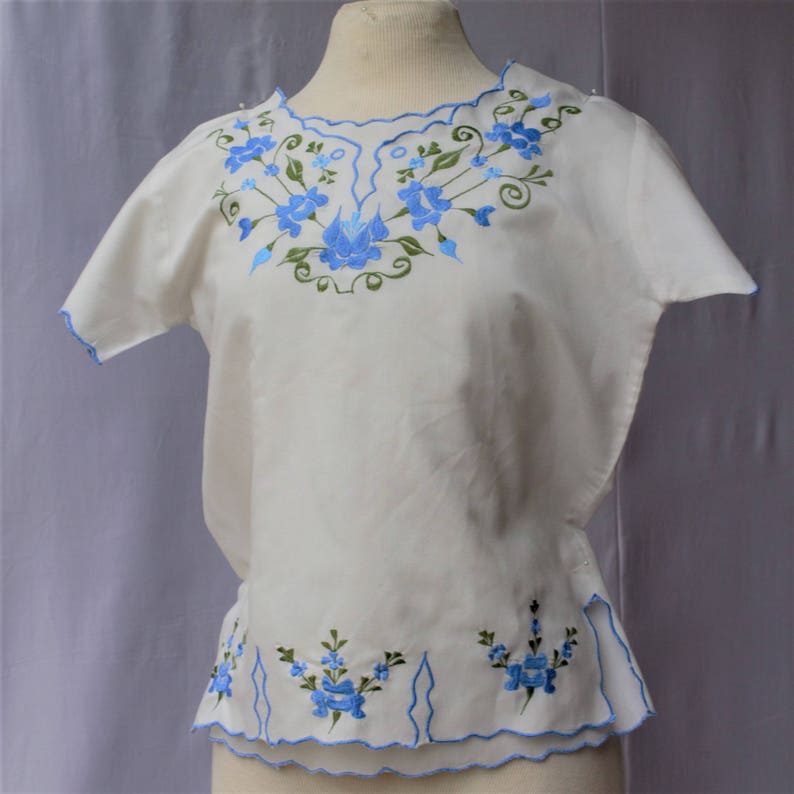 Spectacular SALE Baby Blue Mexican Floral Embroidered Neckline and Hemline Cream Cotton Short Sleeve Slip On Blouse Top Size Small