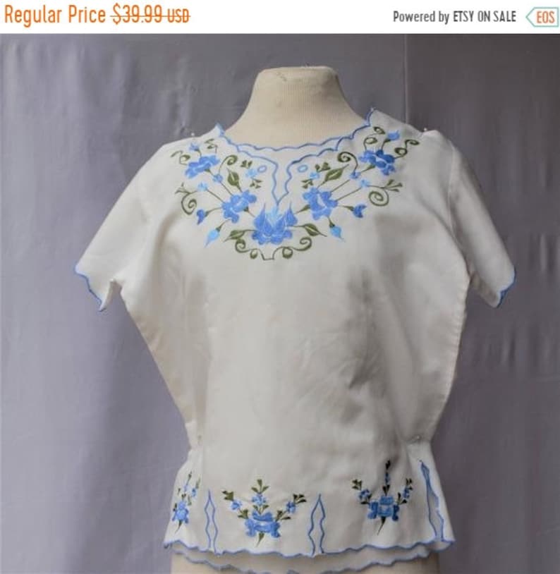 Spectacular SALE Baby Blue Mexican Floral Embroidered Neckline and Hemline Cream Cotton Short Sleeve Slip On Blouse Top Size Small