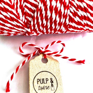 May include: Red and white baker's twine with a brown tag that says "PULP & twine" in a circle.