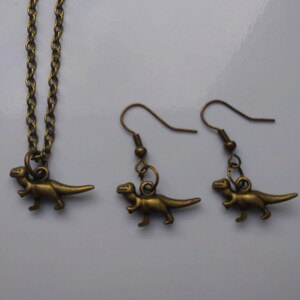 Conjunto delicado de colar e brinco T-Rex em bronze