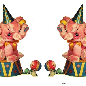 May include: Two pink plush elephants wearing party hats and sitting on blue and gold circus platforms. Each elephant has a yellow bow and is holding a yellow ball. Two red, white, and blue balls with green and white accents are in front.