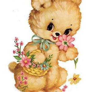 May include: A plush brown teddy bear with a blue bow holding a basket of pink and blue flowers. The bear has large, black eyes and a pink nose.
