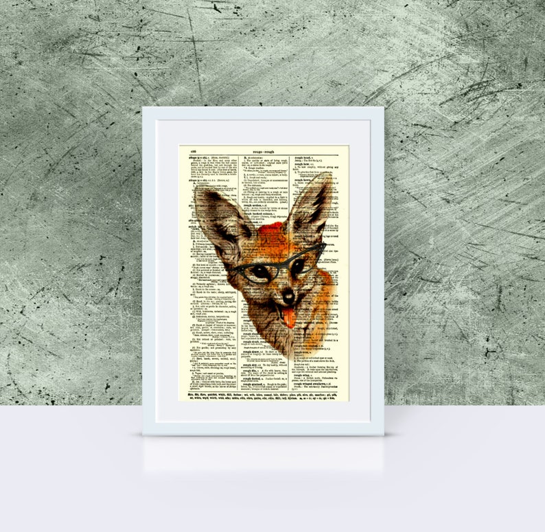 May include: Framed artwork featuring a whimsical fox illustration. The fox, rendered in shades of brown and orange, is adorned with glasses and a small red hat. The artwork is set against a vintage dictionary page background, adding a unique, artistic touch.