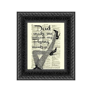 May include: A black and white illustration of a woman's legs wearing striped stockings and high heels. The text "Don't make me unleash my flying monkeys!" is printed on a vintage dictionary page.