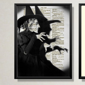 May include: Black and white photograph of a witch wearing a pointed hat and a long black dress. The witch is standing in front of a page from a dictionary, with the word "rough" highlighted. The witch's shadow is cast on the page, creating a spooky effect.
