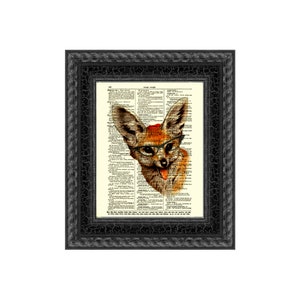 May include: Framed artwork featuring a whimsical illustration of a fox wearing glasses and a red hat, set against a vintage dictionary page background. The black frame has a textured, crackled finish.