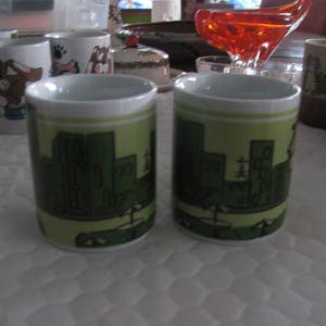 Vintage set of four tea mugs (tea in in french in front of a parisien setting.)   Morris International Inc.