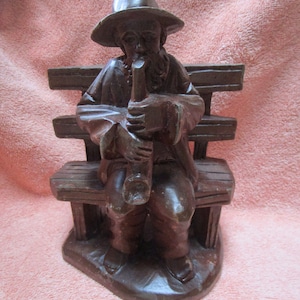 Trumpet player on bench made of wood - folk art