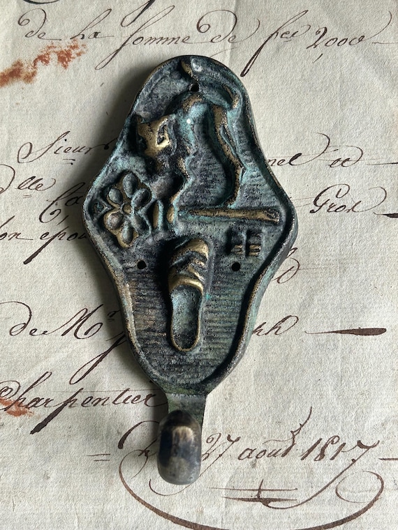 Brass, Patinated Hook with Cat, Key, and Slipper Motifs