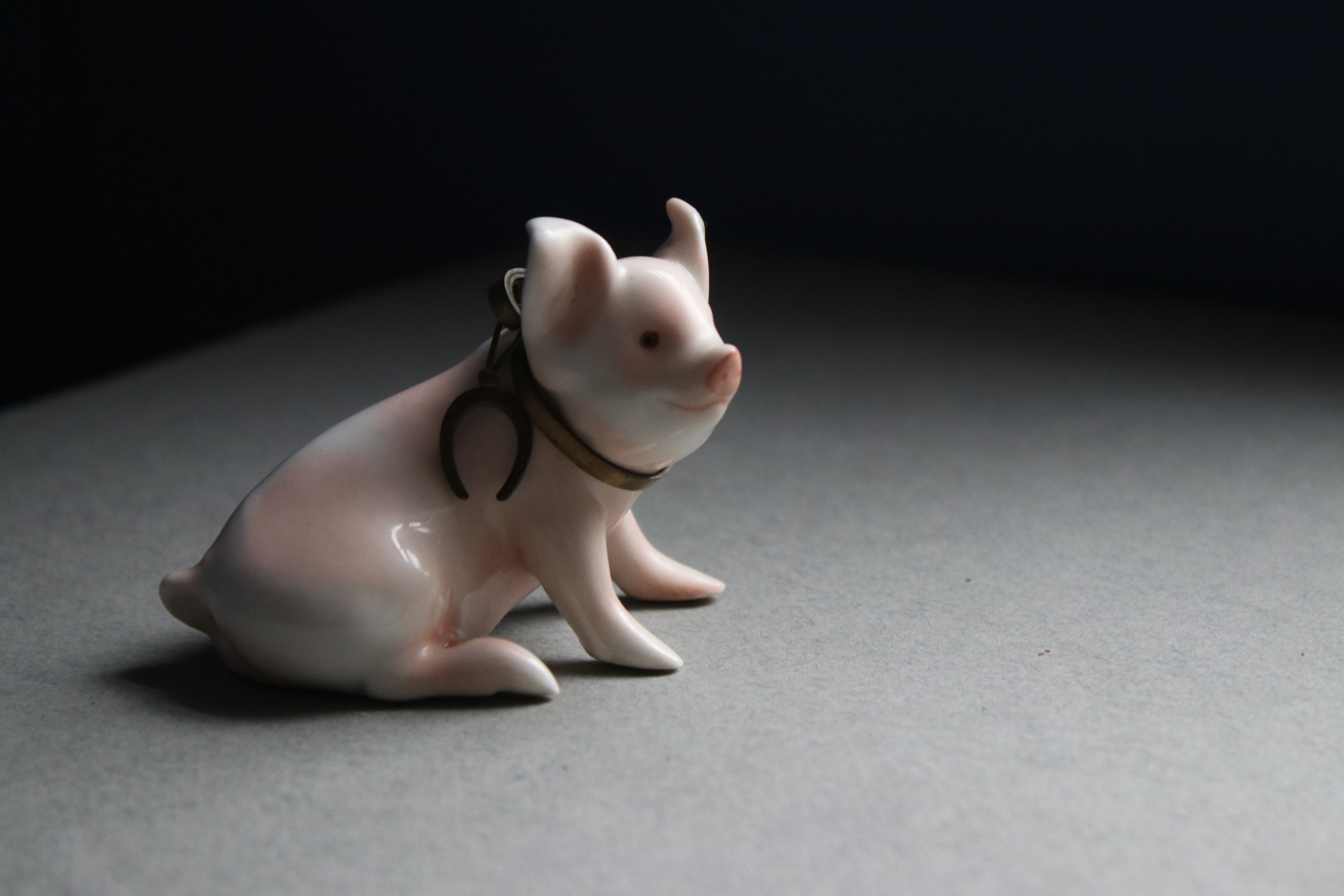 Pink and White Porcelain Pig Figurine with Horseshoe Collar