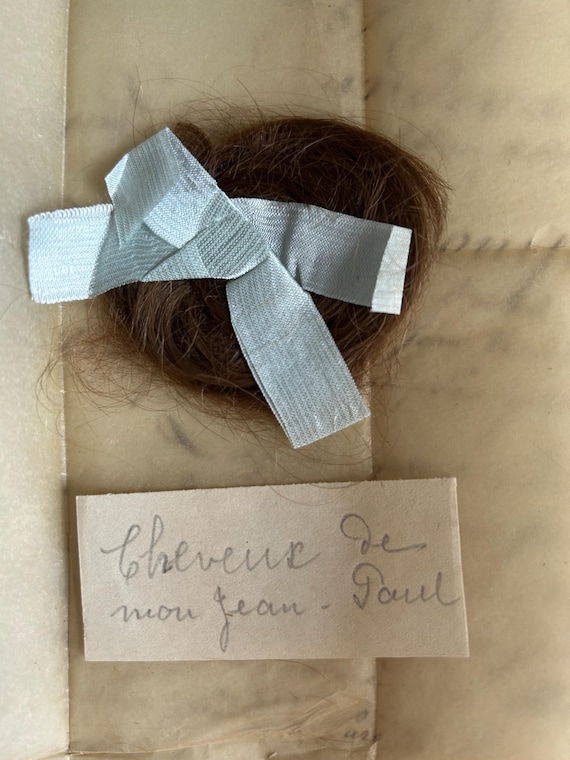 A Beribboned Lock of Hair, from France