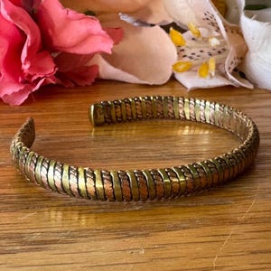 Slanke armband van gemengd metaal, goud en koper