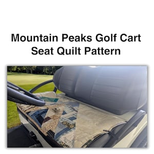 May include: A golf cart seat quilt pattern with a finished size of approximately 28" x 42". The quilt features a patchwork design with blue, beige, and white fabrics. The text reads "Mountain Peaks Golf Cart Seat Quilt Pattern".