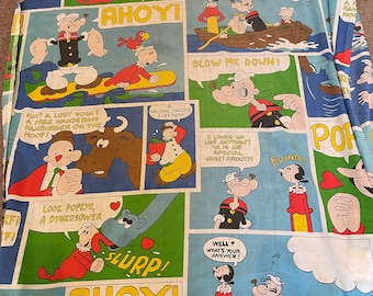 May include: A colorful fabric featuring a repeating pattern of Popeye the Sailor Man comic strips. The fabric features Popeye, Olive Oyl, and Bluto in various scenes, including Popeye eating spinach, Popeye and Olive Oyl in a boat, and Popeye fighting Bluto. The fabric is blue, green, yellow, red, and black.