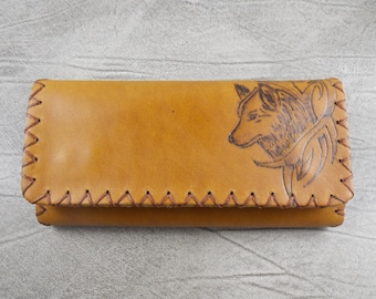 Tobacco pouch handmade of leather with pyrography of a wolf