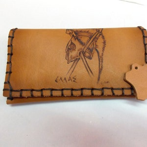 Handmade exclusive leather tobacco pouch. Spartan helmet pyrography print