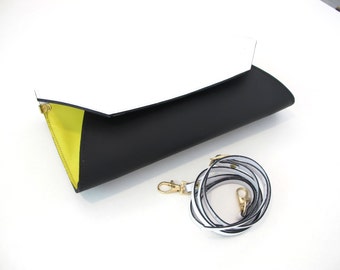 Leather clutch bag with removable strap. Available in many colors