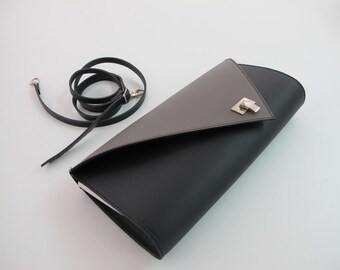 Leather clutch bag with removable strap. Available in many colors