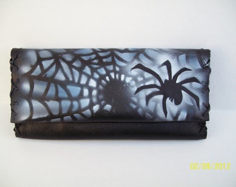 Handmade leather tobacco pouch in black with airbrush spinter print.