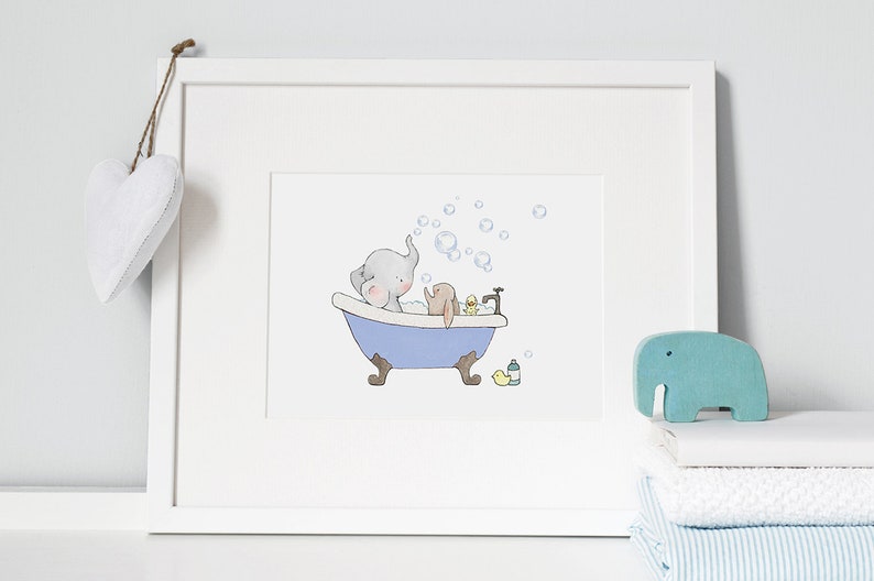 May include: A framed illustration of an elephant and a rabbit taking a bath in a blue bathtub with bubbles. There is a yellow rubber ducky and a bottle of soap in the tub. A blue wooden elephant figurine is on a white towel.