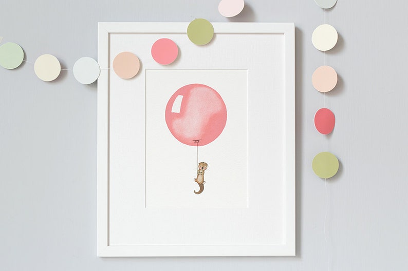 May include: A framed illustration of a small brown animal holding onto a pink balloon string. The illustration is surrounded by a white frame and a garland of pastel colored circles.
