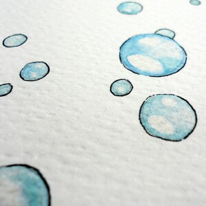 May include: Watercolor painting of several blue bubbles with black outlines on a white background. The bubbles vary in size and have white highlights, creating a sense of depth and dimension. The artwork has a soft, airy feel.
