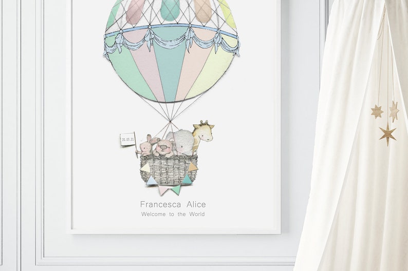 May include: A pastel-colored hot air balloon with a blue and white striped canopy carries a basket of stuffed animals, including a giraffe, elephant, pig, and bunny. The balloon is decorated with white string and a banner that reads "Francesca Alice Welcome to the World".
