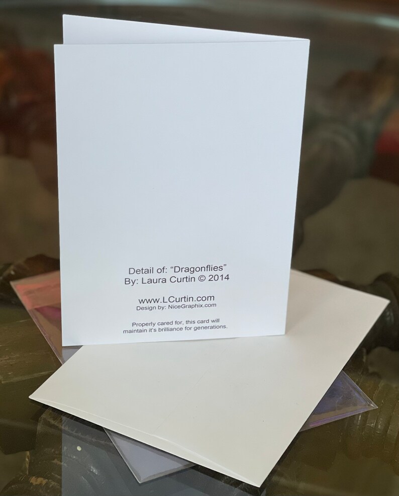 May include: White card with text that reads "Detail of: "Dragonflies" By: Laura Curtin &copy; 2014 www.LCurtin.com Design by: NiceGraphix.com Properly cared for, this card will maintain its brilliance for generations."