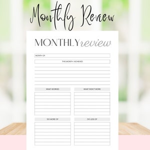 May include: A printable monthly review worksheet with sections for month, achievements, what worked, what didn't work, do more of, and do less of.
