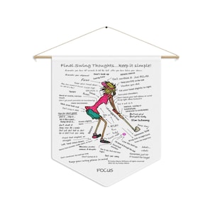 May include: A white pennant flag with a golf-themed illustration and text. The image features a cartoon golfer in a pink shirt and green shorts, with swing tips and phrases like "Focus" and "Relax" written around the figure. The pennant is suspended from a wooden rod.