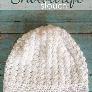 May include: White crocheted slouch hat with a textured stitch pattern. The hat is called "Snowdrift Slouch" and is made by Little Monkeys Crochet.