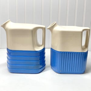 Pair of vintage blue Universal Pottery water or refrigerator jugs, pitchers
