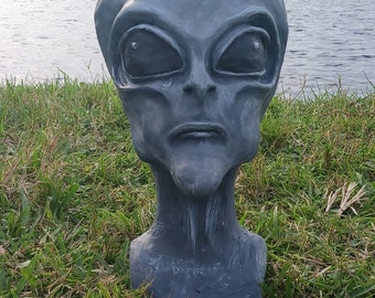 Life-size alien bust sculpted from clay