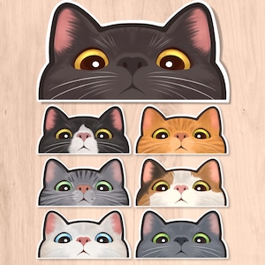 May include: A collection of cat face stickers in various colors and patterns. The stickers feature different cat breeds with detailed eyes and expressions. The stickers are on a white background.