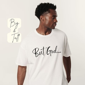 May include: A white t-shirt with the phrase "But God..." in black script. The shirt is worn by a person. The words "Big & Tall" are in a cream-colored box on the left side of the image. The words "For The Moon & Stars" are at the bottom.
