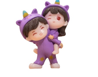 Playful Couple in Purple Unicorn PJs Giving a Piggyback Ride Figurines with a Boy and a Girl, Made of Resin