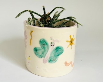 Caterpillar ceramic plant pot