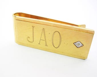 Vintage goudkleurige geldclip gegraveerde letters JAO echte diamant