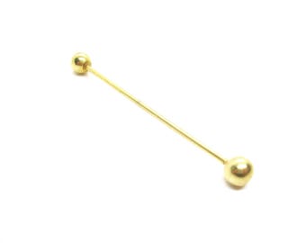 May include: A gold-colored tie pin with a straight, thin bar and a spherical ball at each end. The pin is set against a white background, highlighting its simple design and metallic sheen. This accessory is suitable for formal wear.