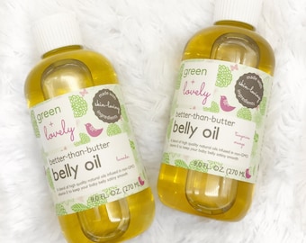 May include: Two bottles of "green + lovely better-than-butter belly oil" with white caps. The labels feature green and pink graphics and text, including "lavender" and "tangerine mango". Each bottle contains 9.0 fl oz (270 ml) of oil.
